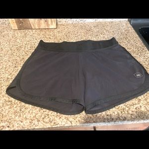Women’s black size Medium REI running shorts. Excellent condition. Lined.